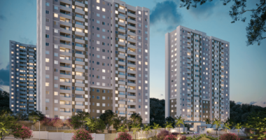 Empreendimento residencial do Grupo Direcional com torres de apartamentos iluminadas, representando expansão da construtora no mercado imobiliário