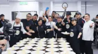 Participantes do Beagá Recebe se reúnem em cozinha durante atividade gastronômica com representantes de cidades criativas da gastronomia da Unesco, que acontecerá em BH